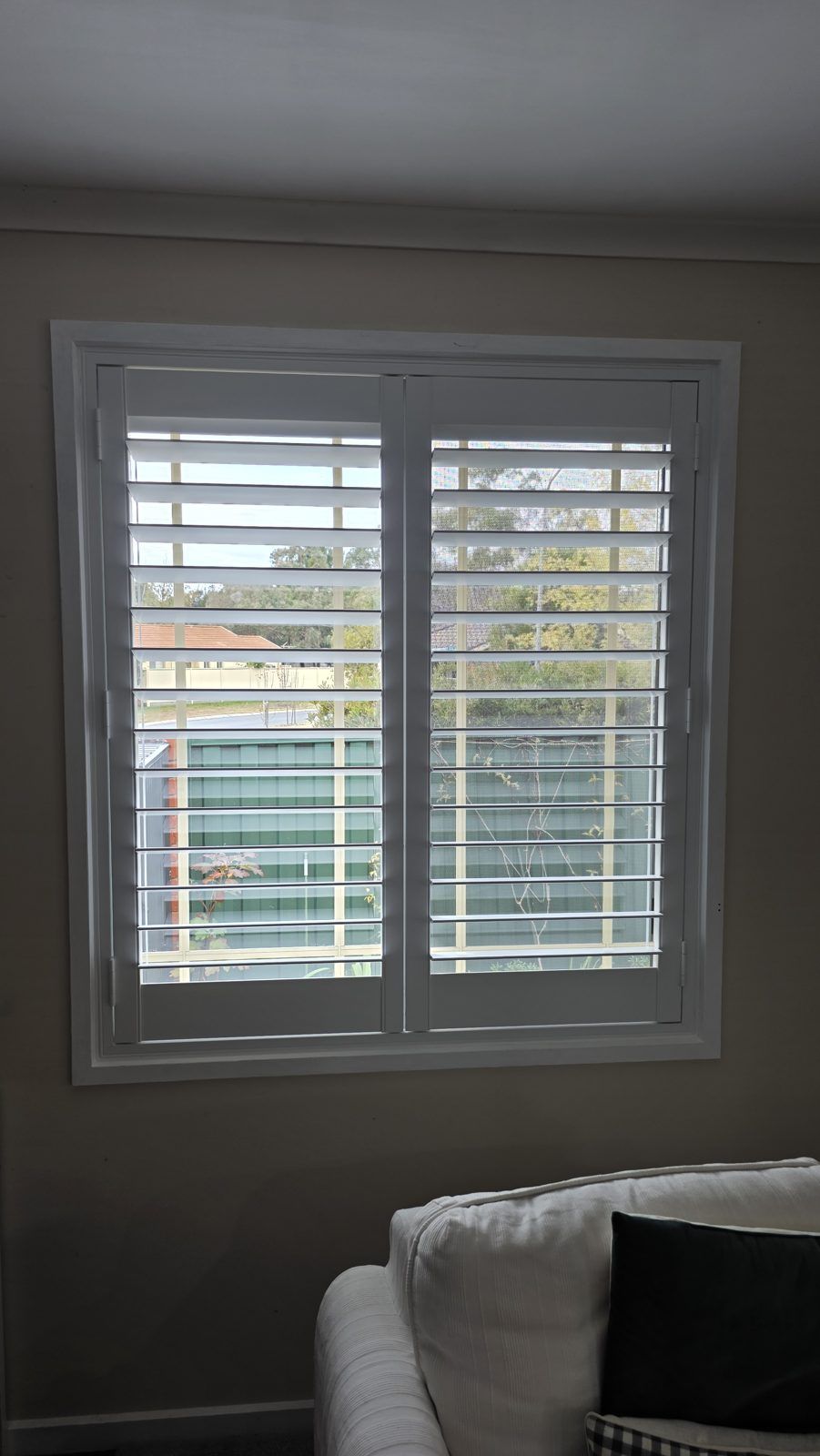 Study window shutters tilted to soften the daylight